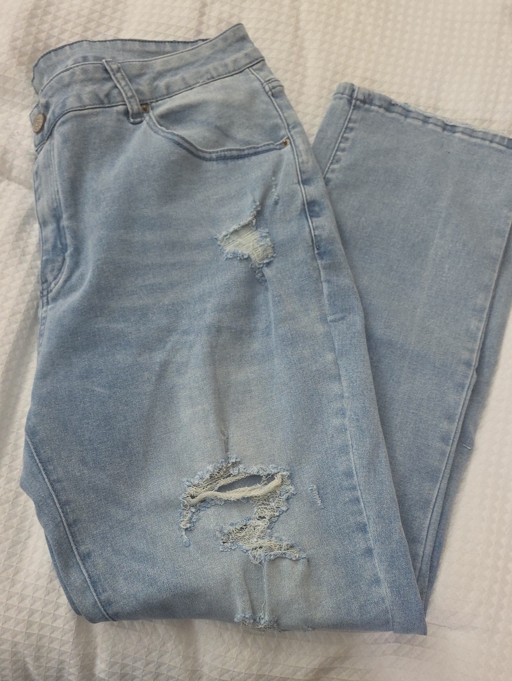 Light blue stretch denim. Boot cut